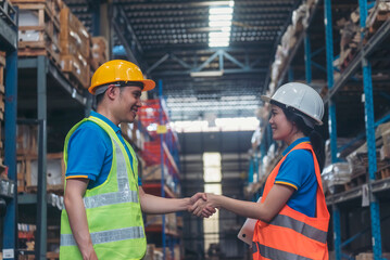 Asian Engineer man, women hands partnership. Coworker colleague logistics Warehouse teams handshake. Teamwork Warehouse worker shakehand together. Support team person teamwork partner logistics team