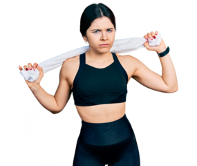 Young brunette woman with blue eyes wearing sportswear and towel skeptic and nervous, frowning upset because of problem. negative person.