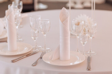 Three empty glasses for alcoholic beverages of vodka, wine and champagne are on the table. High quality photo