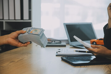 Salesman send key to customer after good deal agreement, successful car loan contract buying or selling new vehicle.