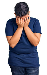 Fototapeta premium Little boy kid wearing casual clothes and glasses with sad expression covering face with hands while crying. depression concept.