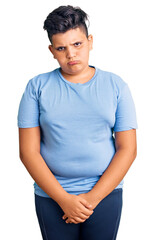 Little boy kid wearing sports workout clothes skeptic and nervous, frowning upset because of problem. negative person.