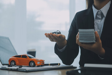 Salesman send key to customer after good deal agreement, successful car loan contract buying or...