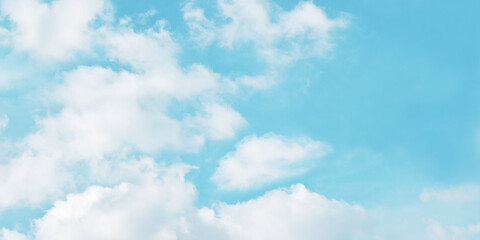 Light blue sky and white clouds. With copy space.	