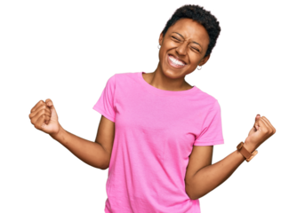 Young african american woman wearing casual clothes very happy and excited doing winner gesture with arms raised, smiling and screaming for success. celebration concept.