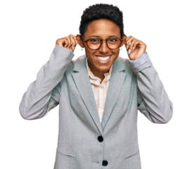 Young african american woman wearing business clothes smiling pulling ears with fingers, funny gesture. audition problem