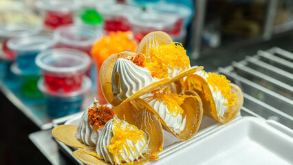 Picture of a type of dessert sold at temple fairs This kind of dessert is known in Thai as Khanom...