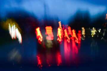 Fototapeta na wymiar light of car on road with accident in the night, blurred background in rainy day