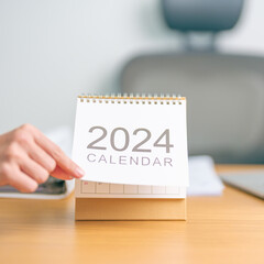 2024 Year Calendar on table background. countdown, Happy New Year, Resolution, Goals, Plan,  Action, Mission and financial Concept