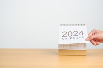 2024 Year Calendar on table background. Happy New Year, Resolution, Goals, Plan,  Action, Mission...