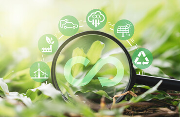 infinity symbol on magnifier glass with environment ecology include reuse reduce recycle carbon...