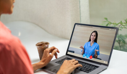 Woman talk speak using laptop computer and video conference online with doctor and stethoscope...