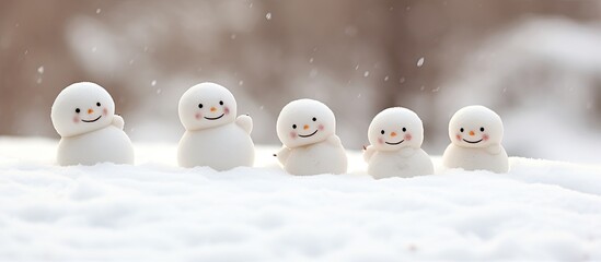 Group of tiny snow figures - obrazy, fototapety, plakaty