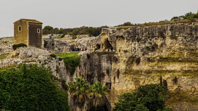 People At Latomie del Paradiso - Historical Ancient Quarry With Caverns In Syracuse, Italy. timelapse