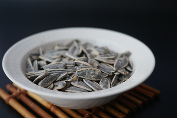 sun flower seeds in a bowl on table 