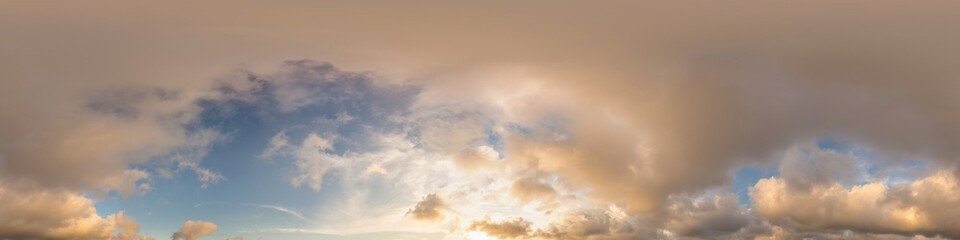 Dark blue sunset sky with glowing golden Cumulus clouds in seamless panorama. HDR 360 spherical...