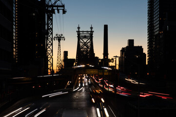 Queensboro Bridge traffic light trails at dawn