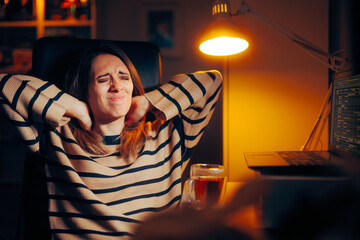 Woman feeling a Pain in her Neck from Desk Sitting. Unhappy office worker experiencing a bad posture professional disease 
