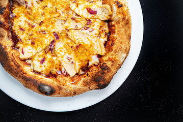 pizza on the black background, top view