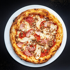 pizza on the black background, top view