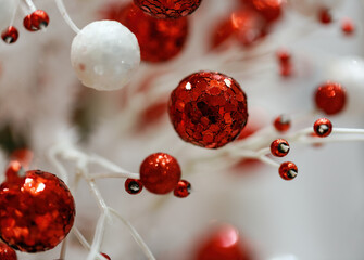 Blur background of Christmas red and white baubles. Christmas ornaments, blurred background with...