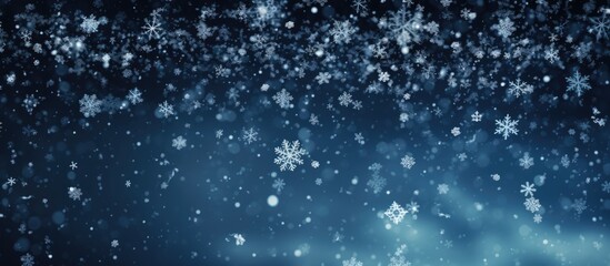 Obraz premium Gorgeous snowflakes drift in the dark sky.