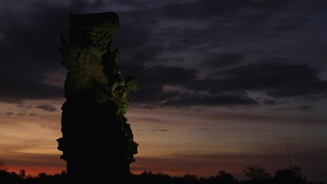 Timelaps of Statue of Garuda Wisnu Kencana on sunset, Bali, Indonesia