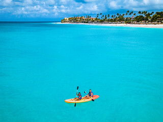 Couple Kayaking in the Ocean on Vacation Aruba Caribbean sea