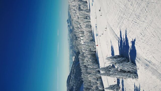 Ski resort Feldberg, Schwarzwald, Germany at winter sunny day. Vertical video