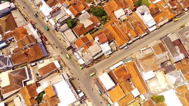 Transportation Footage. Aerial Time lapse of Vehicle crossing the T-junction. Cityscape urban landscape video near Cicalengka Train Station. Shot in 4k resolution from a flying drone.