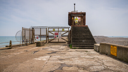 Warning signs and fences in Newhaven Harbour, East Sussex, England, UK