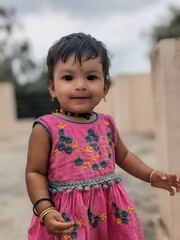 First Step of a Baby girl portrait in Pink dress