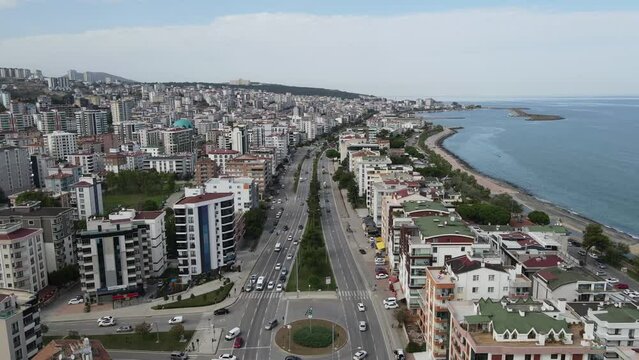 I captured Samsun's cityscape and urban life using a drone. The footage showcases the city's buildings, roads, vehicles, and the dynamic atmosphere. Samsun, located in the Black Sea region of Turkey, 