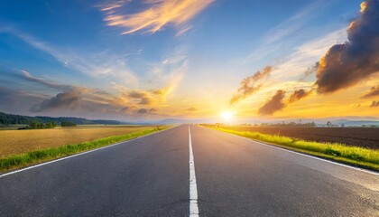 Naklejka premium Rural Serenity: Sunset Panorama of an Empty Asphalt Road