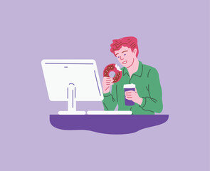 Smiling man eating donut and drinking coffee at workplace with monitor