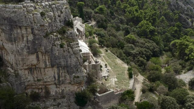 Reveals Pustinja Blaca - Stone Desert Hermitage On Brac Island, Dalmatia, Croatia. Aerial Drone Shot