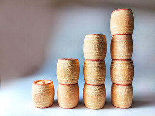 Small wooden barrels with numbers built in columns. The concept of progressive movement in...