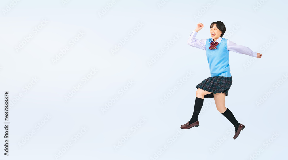 Aufkleber ジャンプする制服を着た女子学生　切り抜き全身写真（切り抜き背景透過pngも販売しております。作成者リンクから「png」で検索してください）