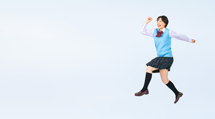 Fototapeta na wymiar ジャンプする制服を着た女子学生　切り抜き全身写真（切り抜き背景透過PNGも販売しております。作成者リンクから「PNG」で検索してください）