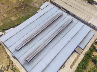 Industrial Photography. Aerial Landscapes. Top view of Food processing factory district in the Pendeuy area, located on the edge of the city of Bandung - Indonesia. Aerial Shot from a flying drone.
