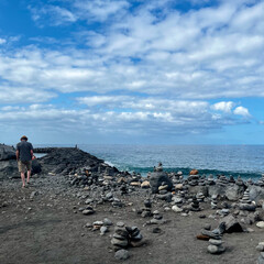 Fototapeta premium Stone figures on a beach with a beautiful sky in Tenerife. Canarian Island. Balance and serenity