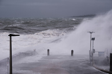 Giant Waves Crashing Over Mornington Jetty. Mornington Pier is a popular destination for a range of recreational activities including sightseeing, fishing and scuba diving.