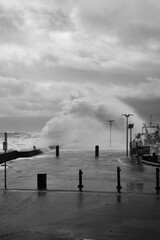 Giant Waves Crashing Over Mornington Jetty. Mornington Pier is a popular destination for a range of recreational activities including sightseeing, fishing and scuba diving.
