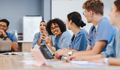 Group of young people showing teamwork and togetherness in medical education