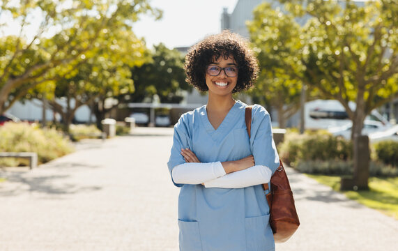 Portrait of an aspiring doctor wearing scrubs and smiling confidently