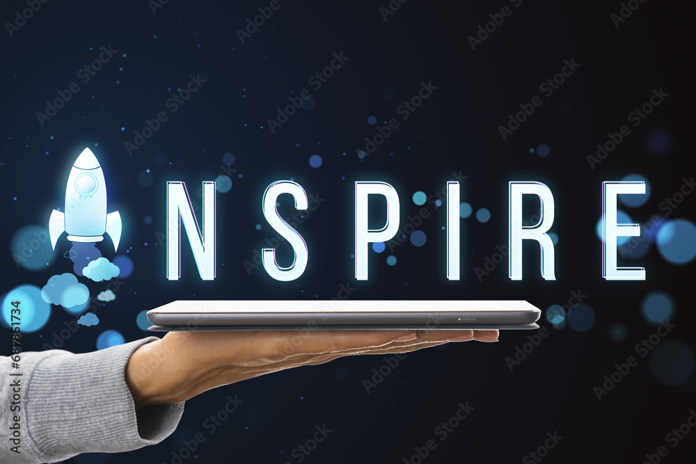 Poster close up of female hand holding tablet with creative text with space ship replacing letter on blurry