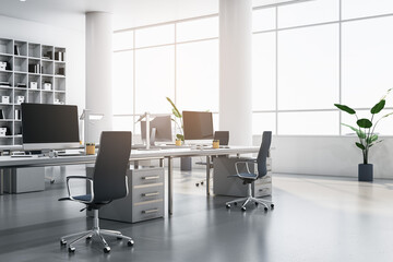 Modern coworking office interior with bookcases, panoramic windows and city view, furniture, equipment and computer monitors. 3D Rendering.