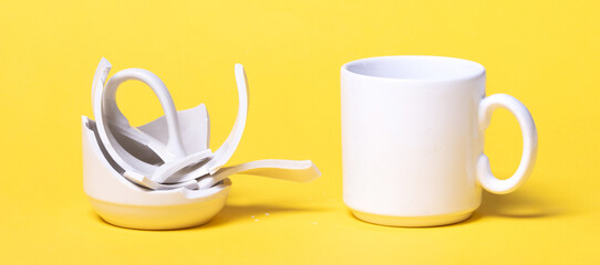 Broken cup isolated on a solid background