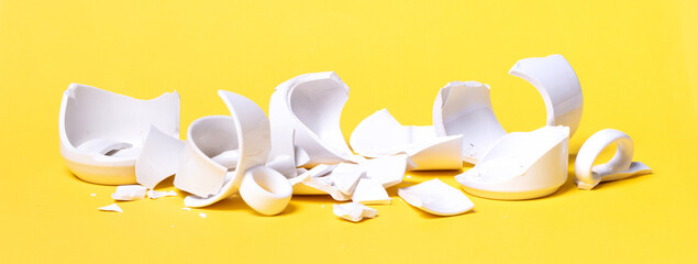 Broken cup isolated on a solid background