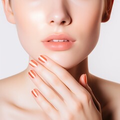 A woman with caramel manicure on nails and natural makeup. Dermatology. Light beige. Cosmetics. Ad campaign. Hands on the chin. Lips. Face. Feminine beauty. Fingers. Nails. Skincare. Spa
